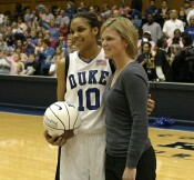 Hilary Howard presents a ball to Duke's new career assist leader, Lindsey Harding