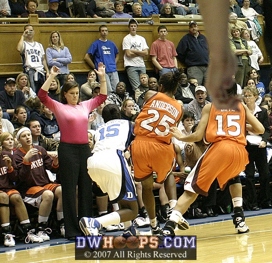 Coach Dunkenberger is unable to draw the charge from Bridgette Mitchell...