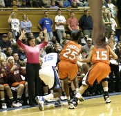 Coach Dunkenberger is unable to draw the charge from Bridgette Mitchell...