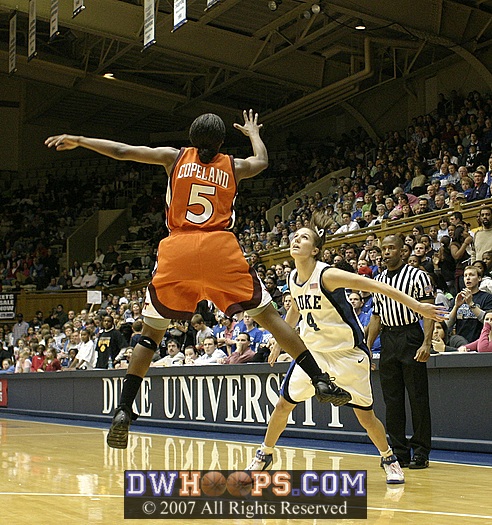 Kirby Copeland tips the ball high into the air...