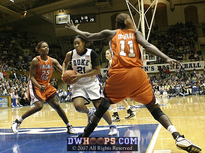 Joy Cheek drives strong to the hoop...