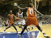Joy Cheek drives strong to the hoop...