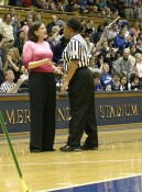 Coach Dunkenburger presumably asks Yvette McKinney why the previous play wasn't a held ball