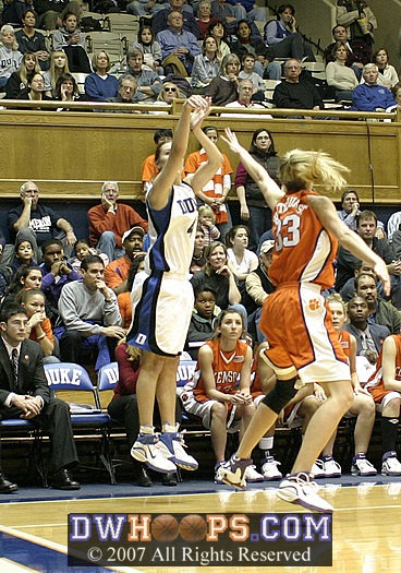 Abby launches a three from the corner...