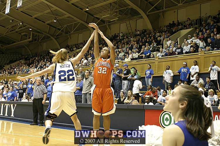 Brittany Mitch challenges Morganne Campbell's three point attempt