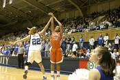 Brittany Mitch challenges Morganne Campbell's three point attempt
