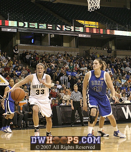 Corinne Groves goes for the ball after stripping Alison Bales