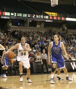 Corinne Groves goes for the ball after stripping Alison Bales