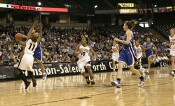On the break, Lindsey Harding gets Yolanda Lavender off her feet, and the foul call.  After discussion, the referees reversed their original decision and called it "on the floor."