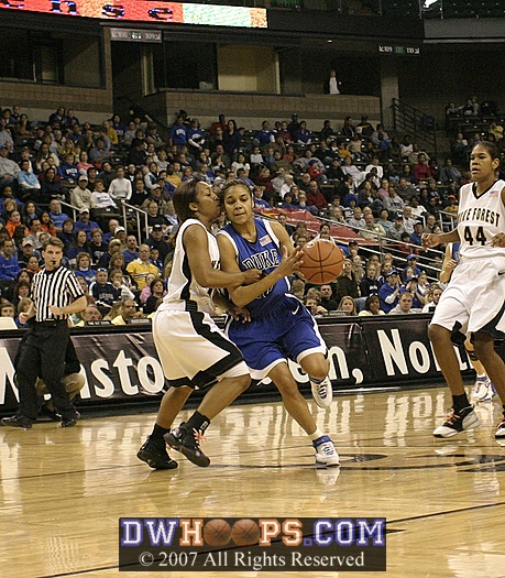 Lindsey Harding is fouled by Tiffany Roulhac