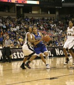 Lindsey Harding is fouled by Tiffany Roulhac