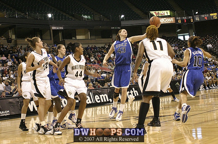 Alison Bales pulls in a long rebound...