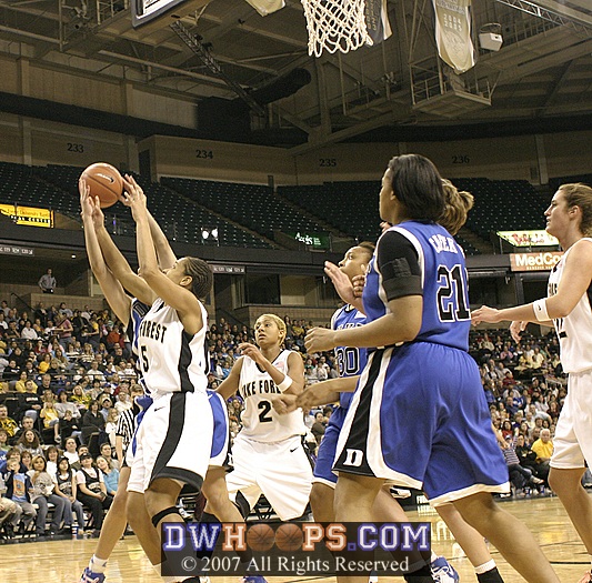 ...but kept the possession alive with an offensive rebound, dishing shortly after to Harding for a Duke second chance hoop.