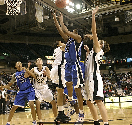Courteney Morris is too late to block Keturah Jackson, and is whistled for the foul.