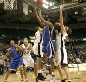 Courteney Morris is too late to block Keturah Jackson, and is whistled for the foul.