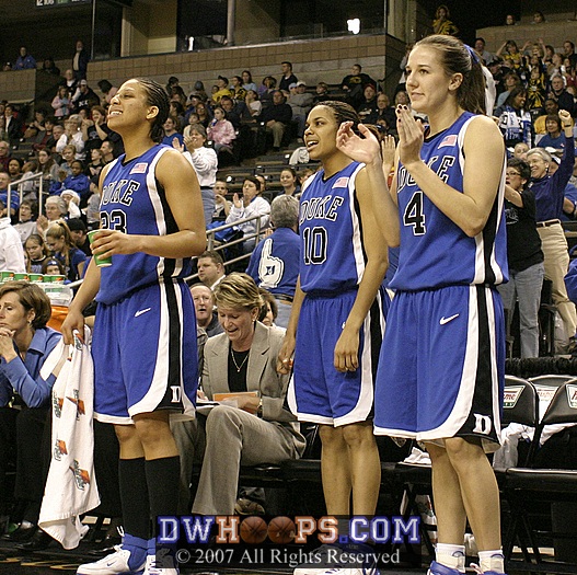 The starting backcourt applauds a fine effort by the reserves.