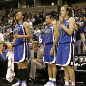 The starting backcourt applauds a fine effort by the reserves.