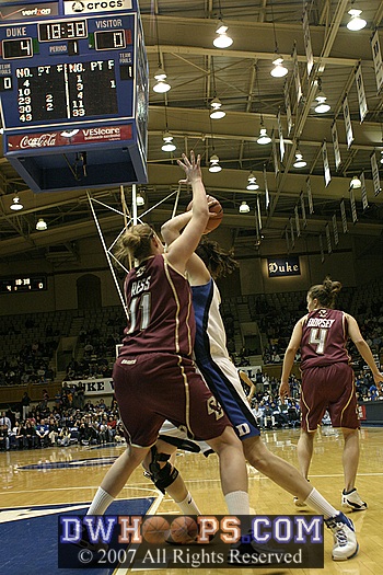 ...but the defense of Kathrin Ress forces her to kick it out...
