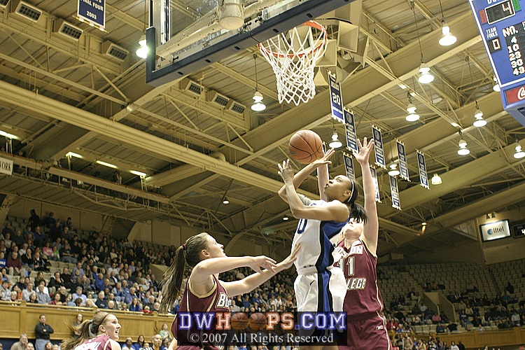 ...and goes to the basket, but is blocked from behind by Ress...