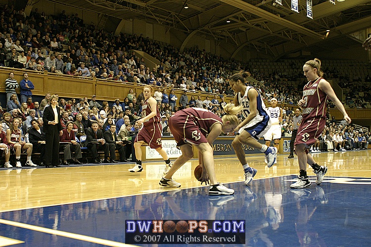 Elisabeth Egnell turns over Lindsey Harding in the lane during a somewhat sloppy stretch by both teams.