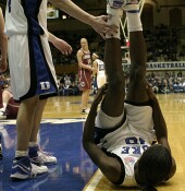 38-22, 5:10 - ...who is whistled for a foul while the shot is in the air, and falls to the ground.