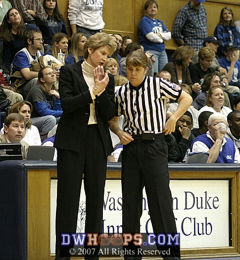 Coach Inglese discusses holds with referee Tina Napier