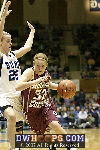 Mickel Picco drives against Brittany Mitch...