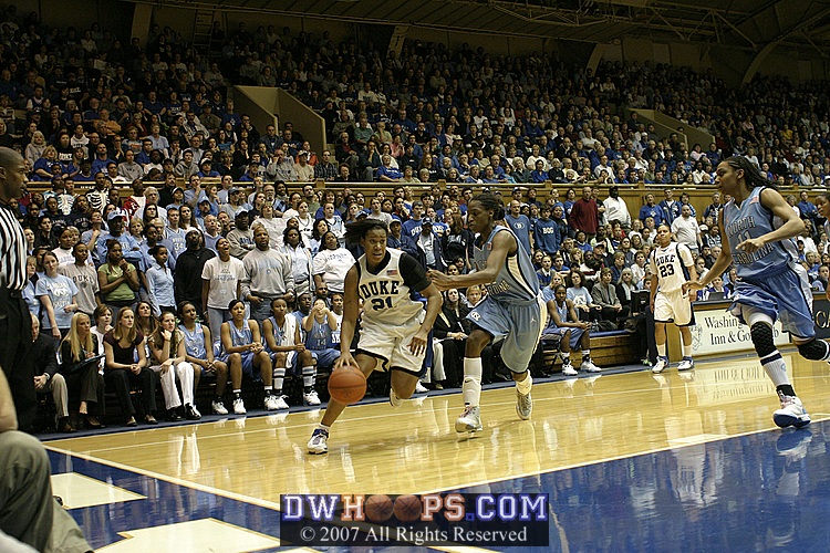 Joy Cheek drives on Rashanda McCants