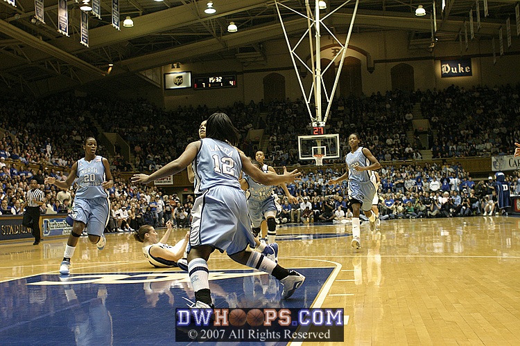 After stealing the ball, Lindsey Harding drives on Ivory Latta