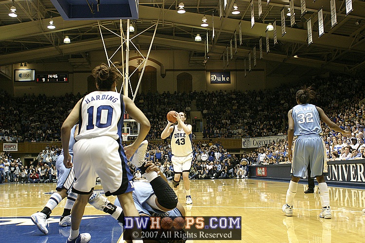 As Larkins falls to the floor in pain, Alison Bales calmly takes and makes her second career three pointer
