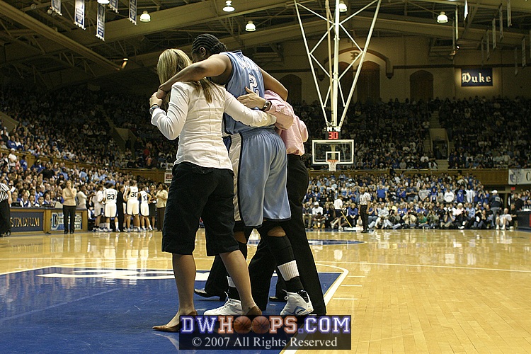 Larkins assisted off the court