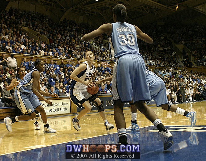 ...but Breland gets a hand on the ball...