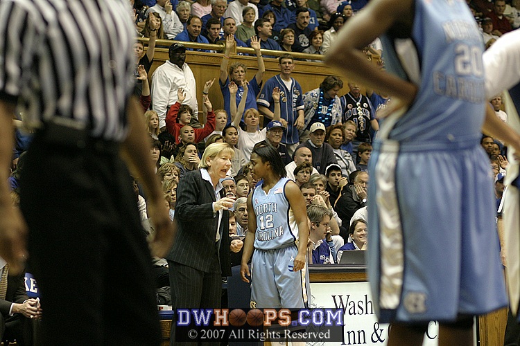 Coach Hatchell instructs Ivory Latta during the first Cheek FT.
