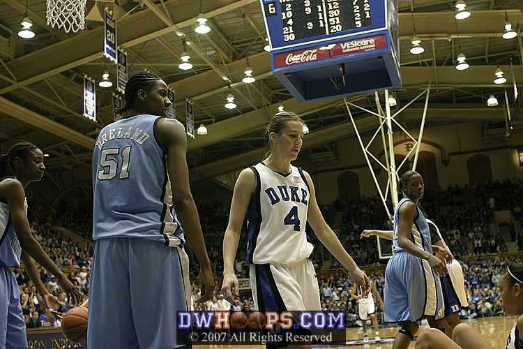 ...and, while the shot was in the air, Breland fouled Abby, so Duke got the deuce and the ball back.