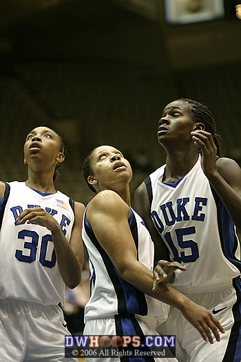 Carrem Gay, Wanisha Smith, and Bridgette Mitchell look to the boards