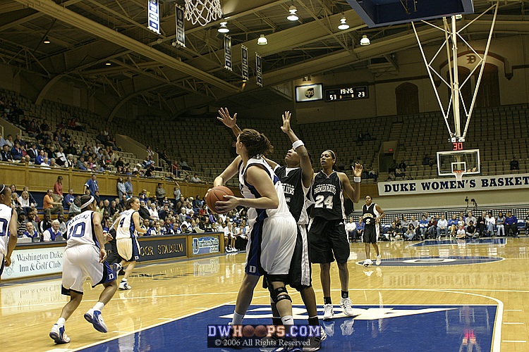 Alison Bales pulls down the rebound