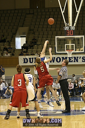 Alison Bales and Northeastern's  Joanna Ausmann (5) center jump at the tipoff