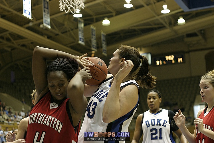 An awkward moment as Alison Bales and Kendra Walton battle for a rebound