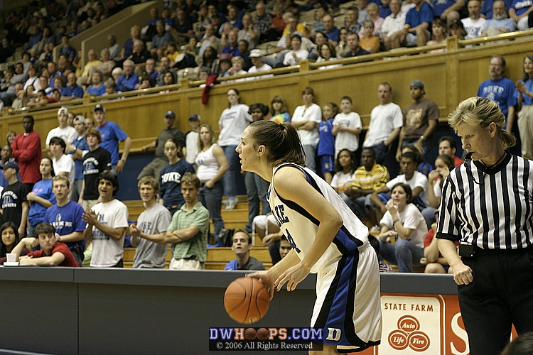 Referee Sally Bell watches Abby Waner