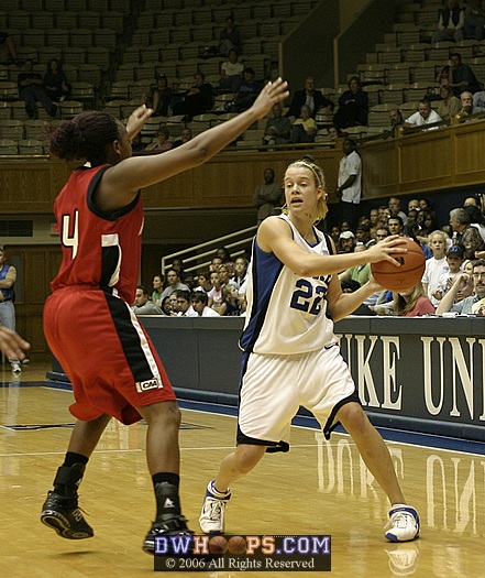 Brittany Mitch looks to get the ball inside, guarded by Kendra Walton