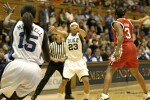Wanisha Smith dumps the ball in to Bridgette Mitchell