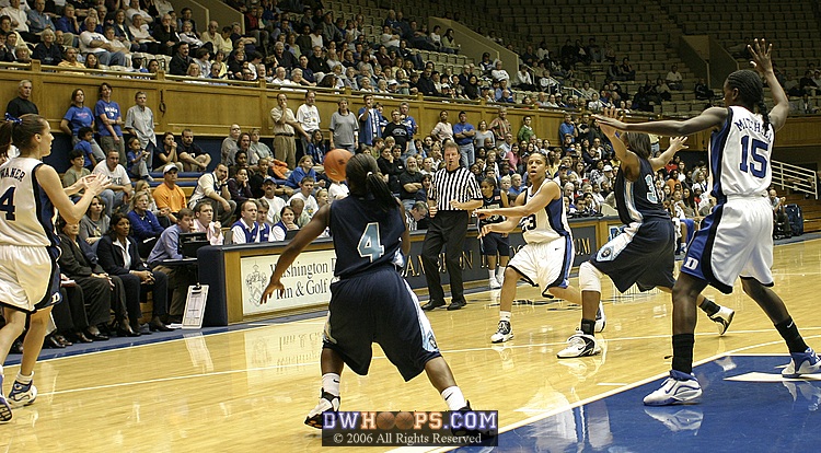 Wanisha Smith passes to Abby Waner, as Bridgette Mitchell establishes in the lane