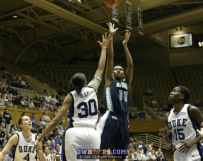 Shahida Williams shoots over Carrem Gay