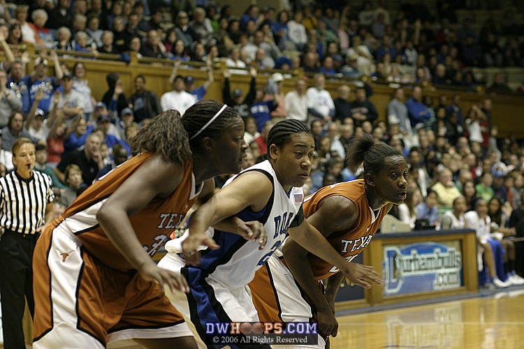 Tiffany Jackson (left), Joy Cheek, and Earnesia Williams fight for position on a Duke free throw attempt (1 of 2)
