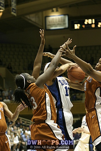 Houston Cy-Fair Alumnae Aubry Cook (left) and Lindsey Harding join fellow Texan Katrina Robinson in a battle for the ball.  Cook was called for the foul.