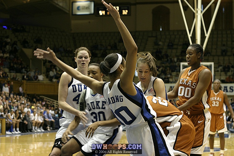 Lindsey Harding and Abby Waner try to get the ball from Niqky Hughes
