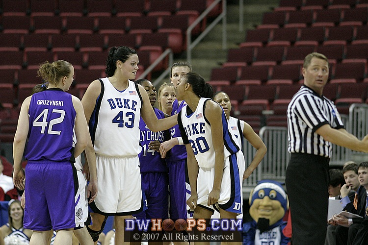 Alison Bales consoles Carrem Gay after a foul call