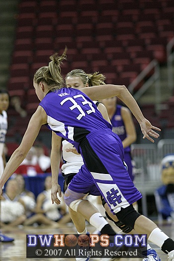 Holy Cross' Brittany Keil drives on Brittany Mitch
