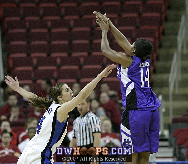 Brianna McFadden pops in a trey over Abby Waner