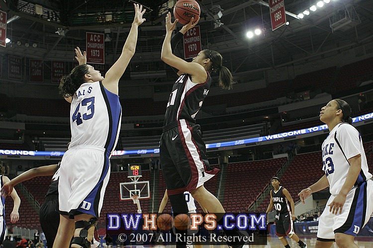Alison Bales extends her career NCAA block mark by rejecting a Hairston jumper